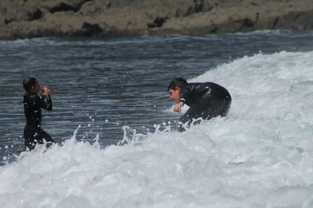 A first surf lesson at Playa de Frexulfe